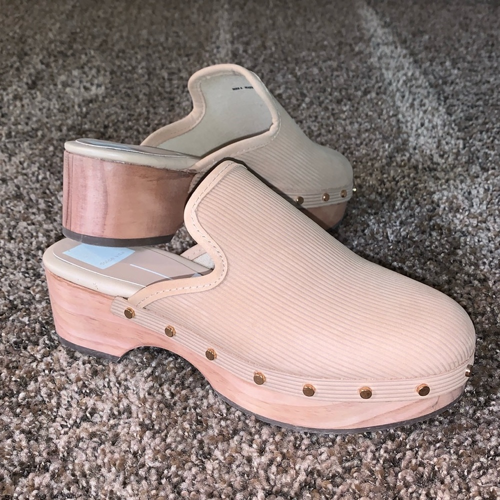 Brand new with tags size 6 clog shoes. Wooden heel gold accents on the side